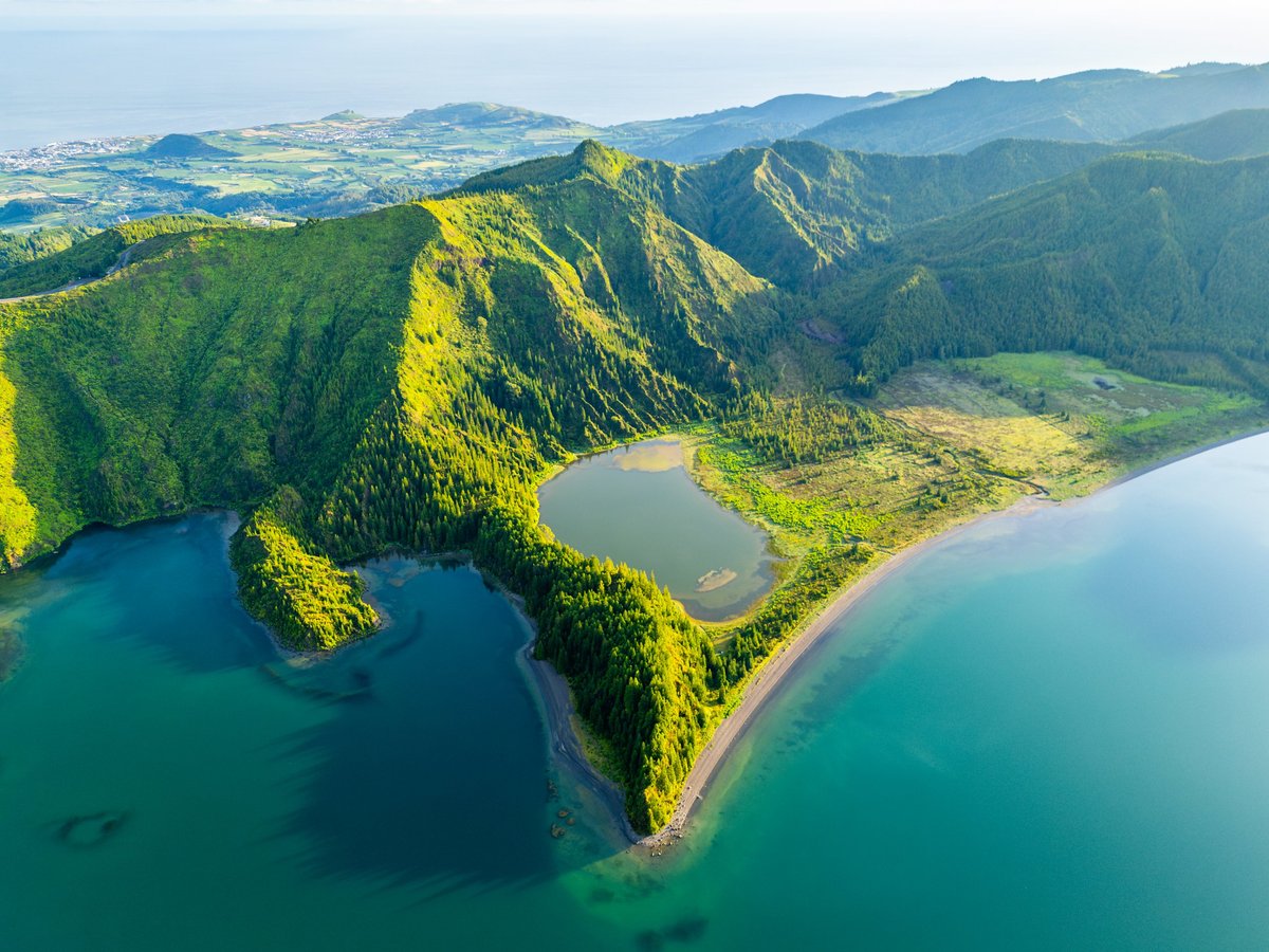 Stunning tropical island with volcanic mountain and crystal clear waters