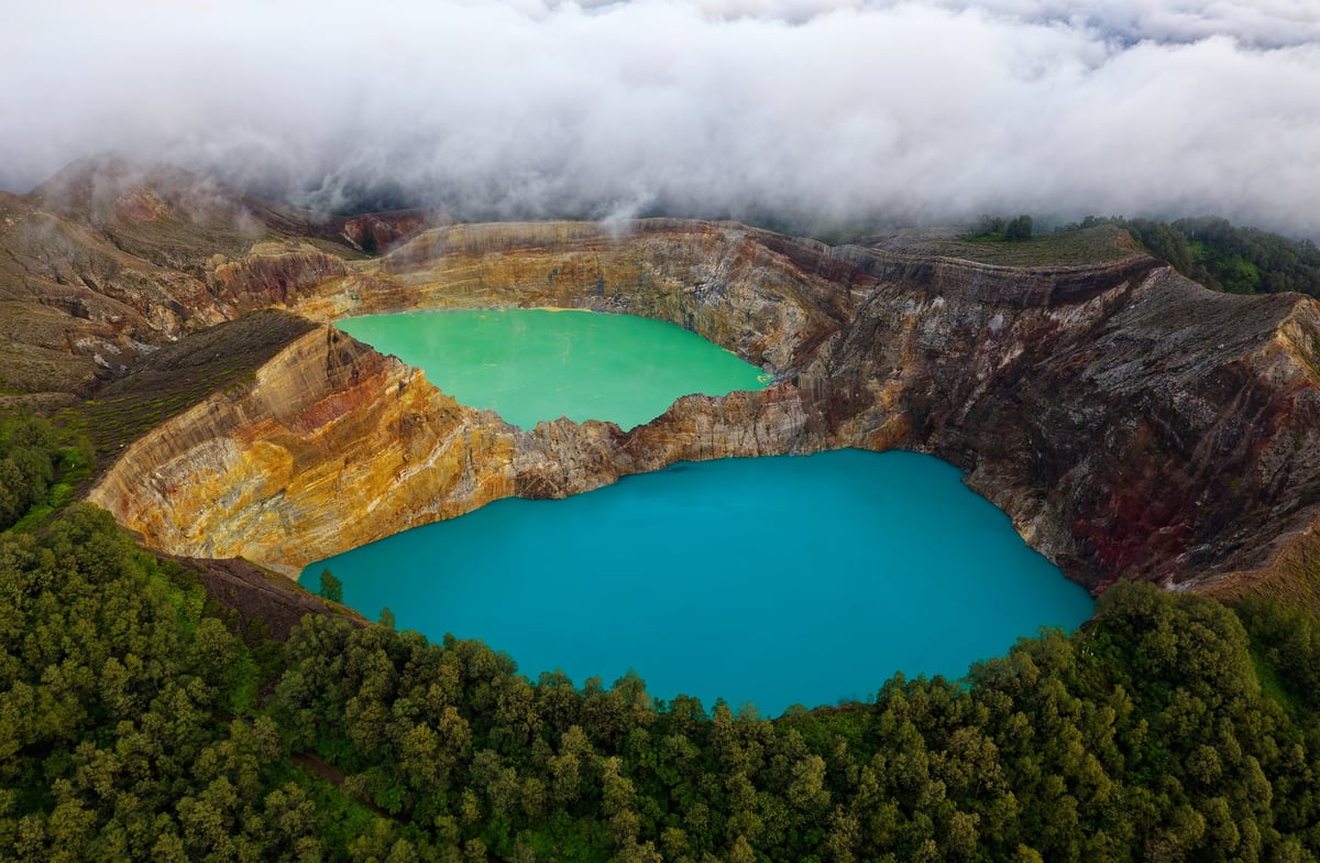 Volcanic crater lake with colorful waters