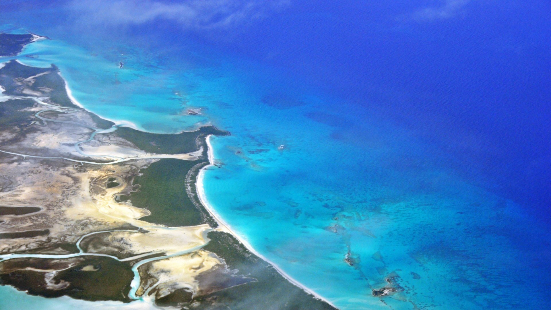 Aerial view of Shroud Cay in the Exumas, with mangrove channels, white sand and bright blue shallows